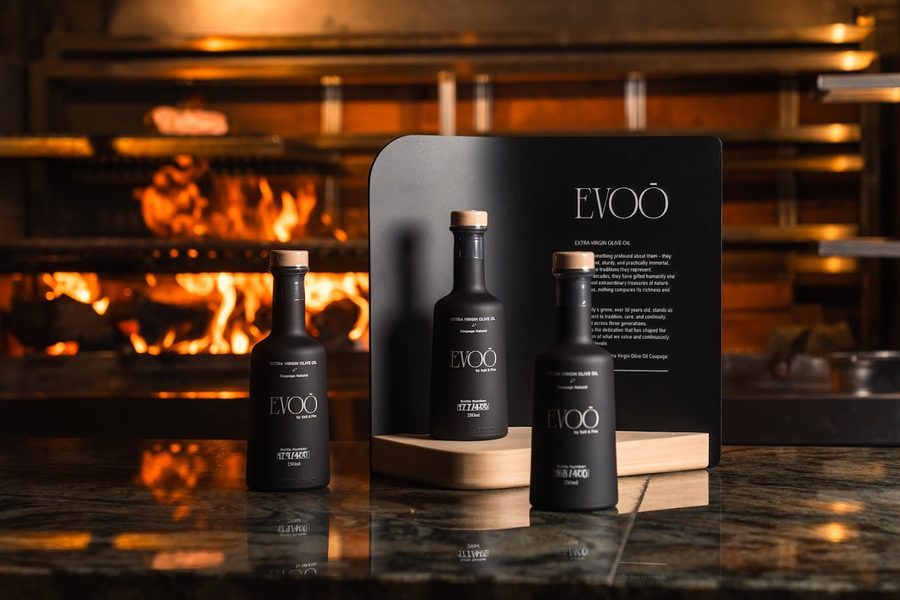 EVOO by Salt & Fire olive oil in front of the fire